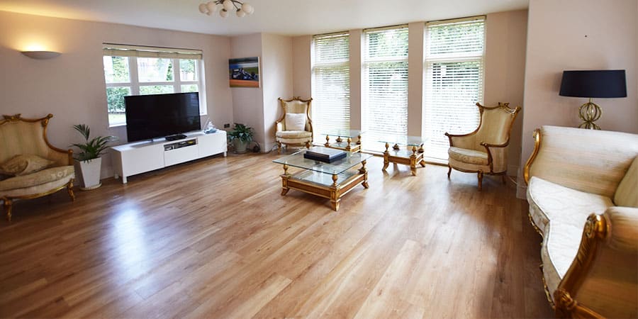Image of a residential living room after the Installation of Karndean flooring in Hale