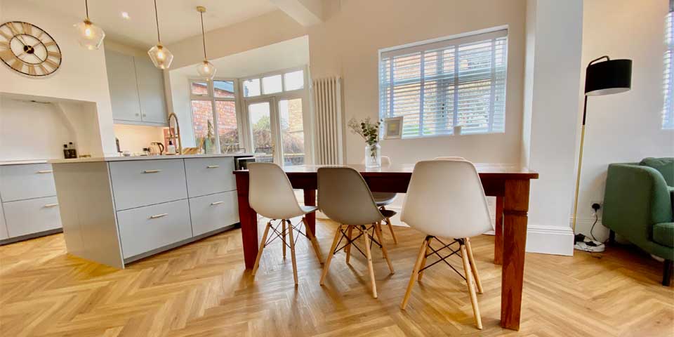 This is an an image of an Installation of Project Floors Parquet Flooring in a residential kitchen in Sale, Cheshire, M33
