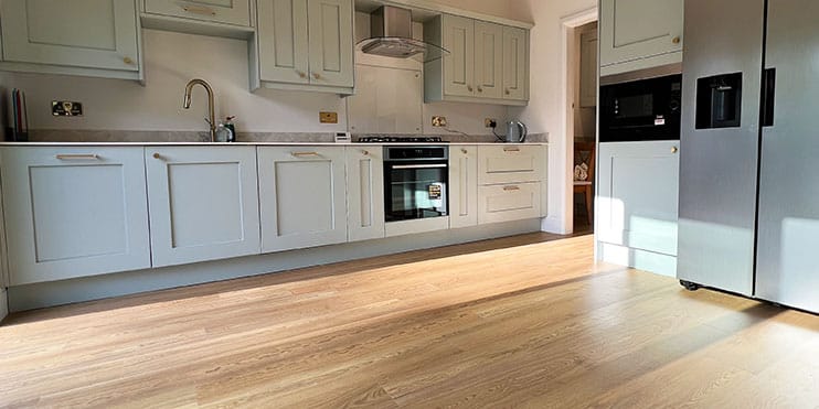 Amtico Spacia flooring in traditional light oak oak installed in a kitchen and dining space in Urmston