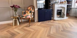 Oak Herringbone flooring installed in a neutral living room and dining space