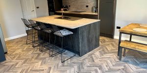 Grey Herringbone flooring installed in in a luxury kitchen in Irlam, Salford
